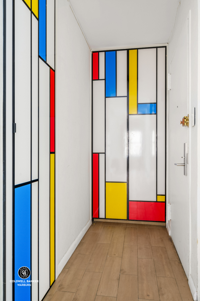 118 East 60th Street, Unit 7B Manhattan, NY 10022 - Photo 6 of 15 a view of utility room with an empty room and floor to ceiling window
