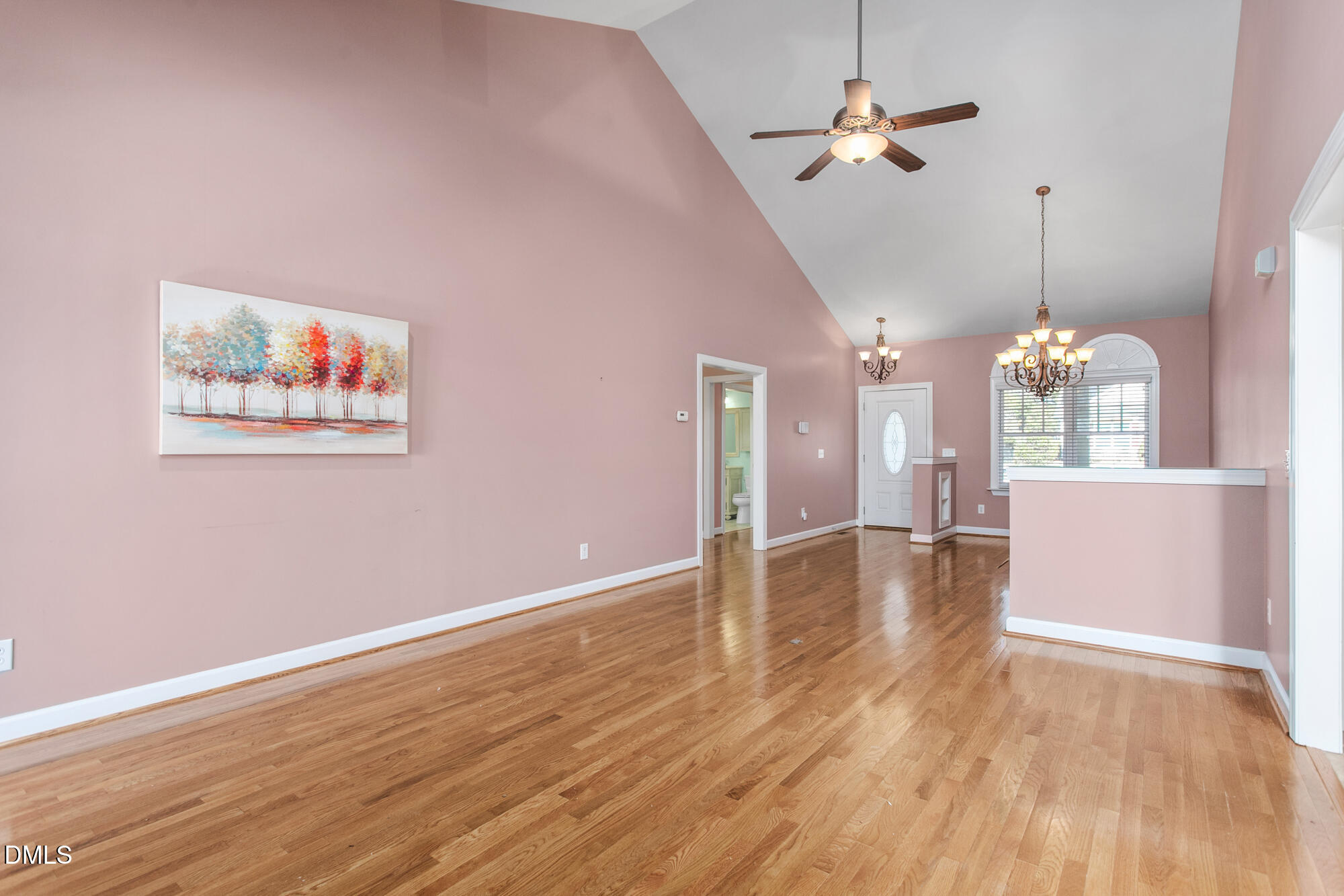 520 Grandview Drive Graham, NC 27253 - Photo 11 of 32 a view of a room with wooden floor a ceiling fan and window