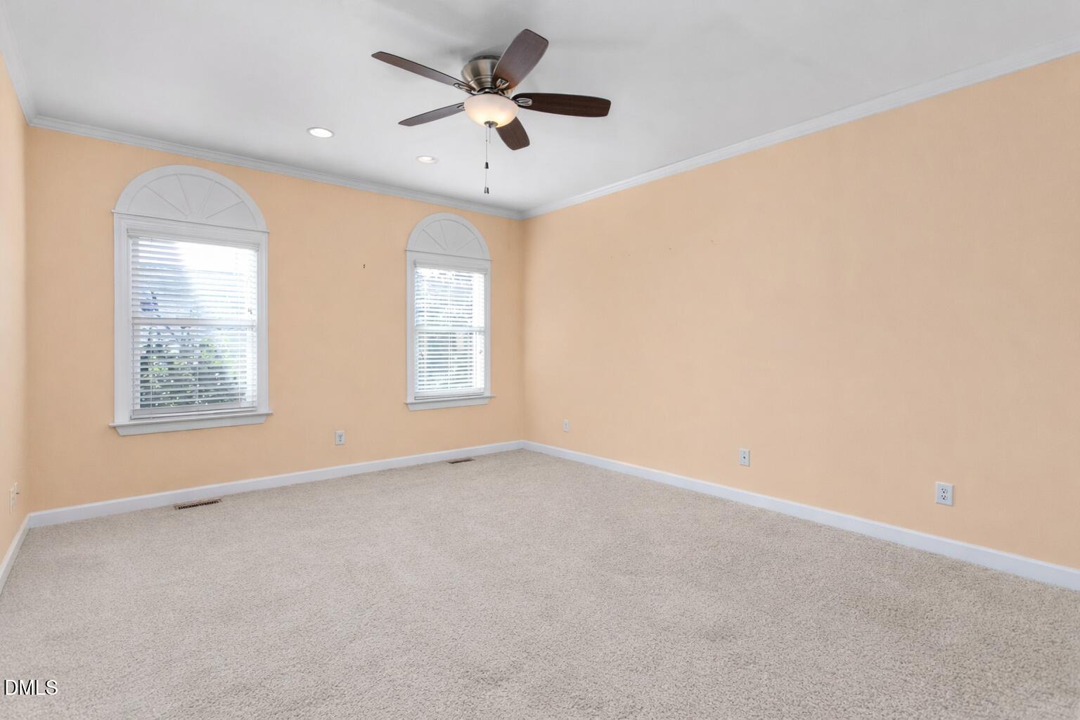 520 Grandview Drive Graham, NC 27253 - Photo 21 of 32 an empty room with windows and fan