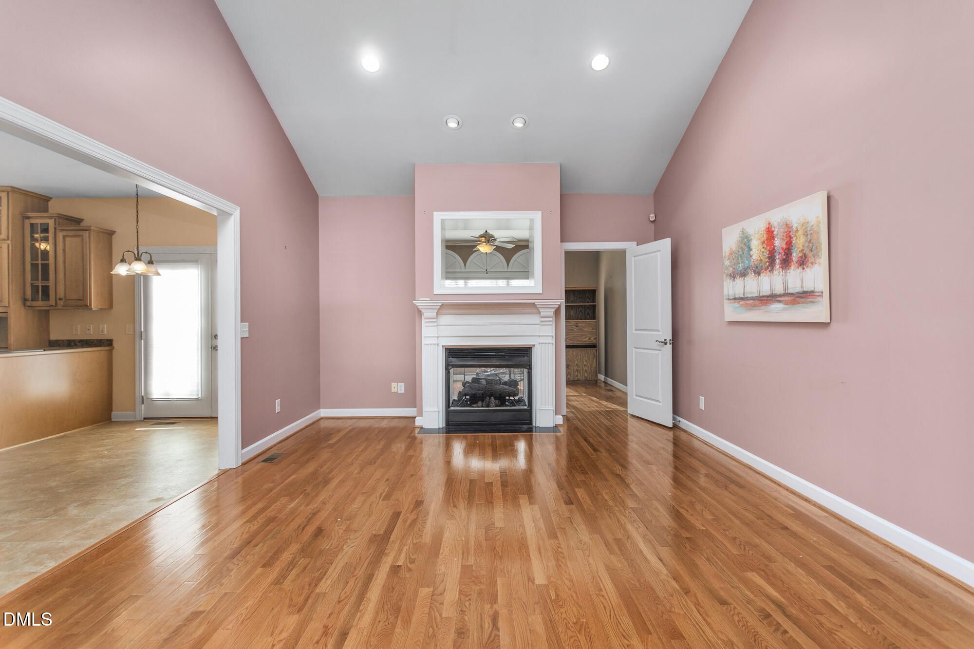 520 Grandview Drive Graham, NC 27253 - Photo 10 of 32 a view of a livingroom with wooden floor a fireplace and window