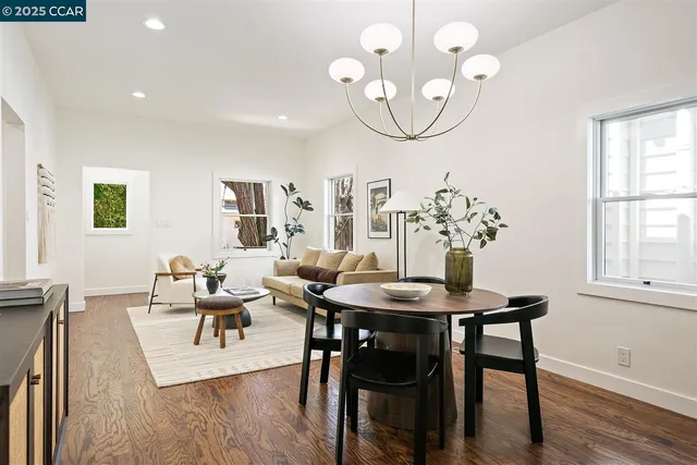 a kitchen with stainless steel appliances kitchen island a chandelier