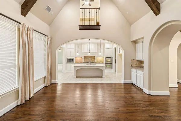 a view of an entryway with wooden floor