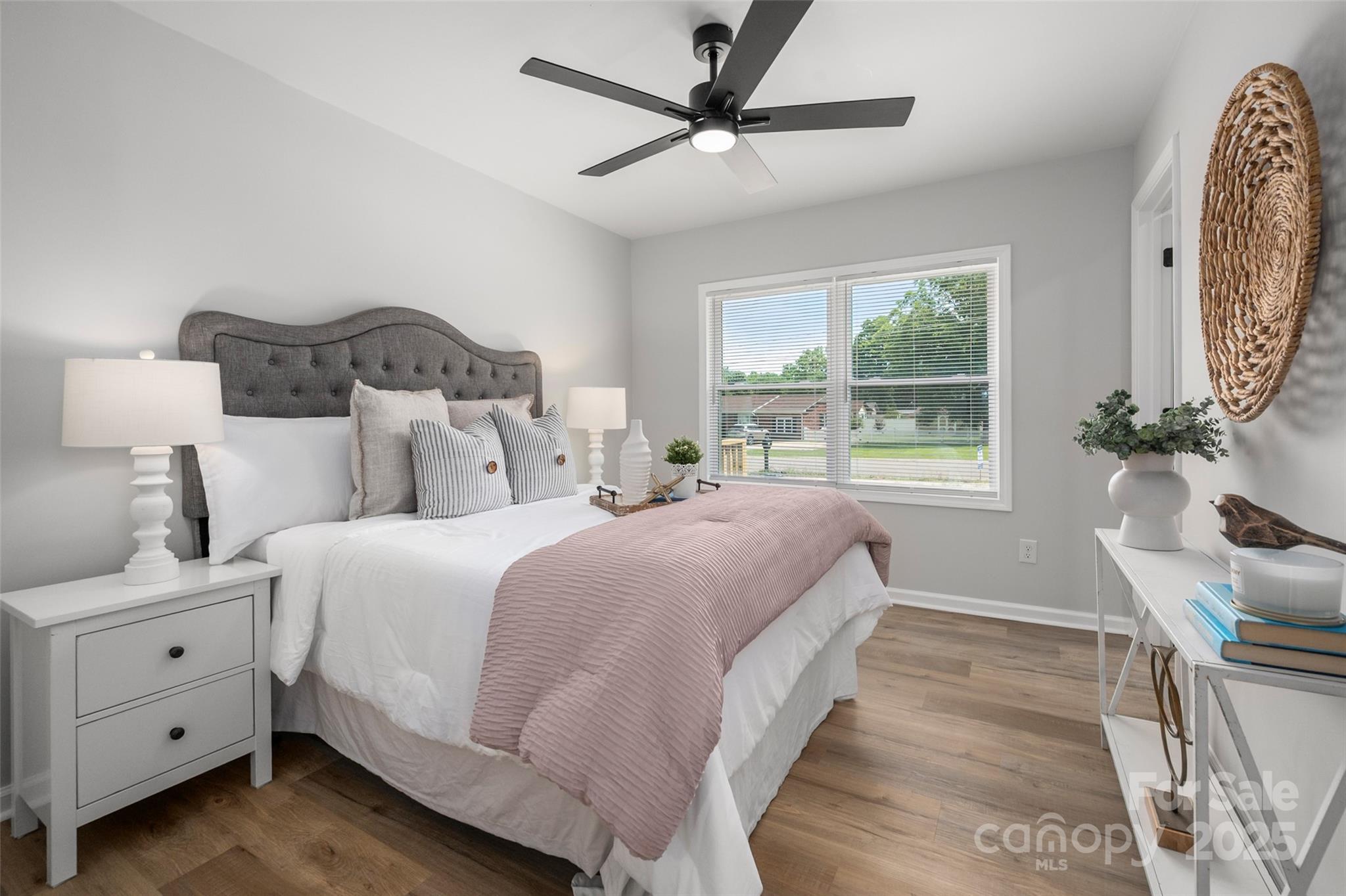756 Logan Street Mooresville, NC 28115 - Photo 14 of 30 a bedroom with a large bed and a window