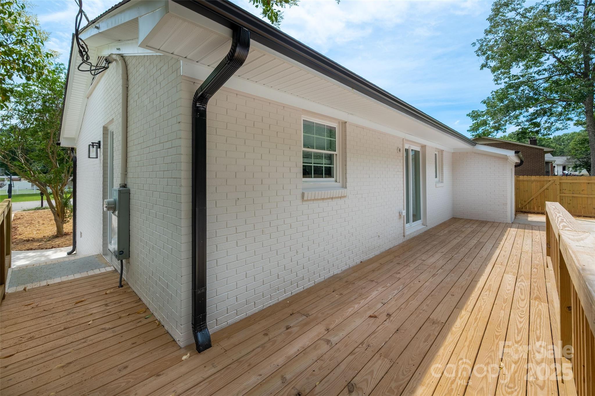 756 Logan Street Mooresville, NC 28115 - Photo 22 of 30 a view of balcony with wooden floor and fence