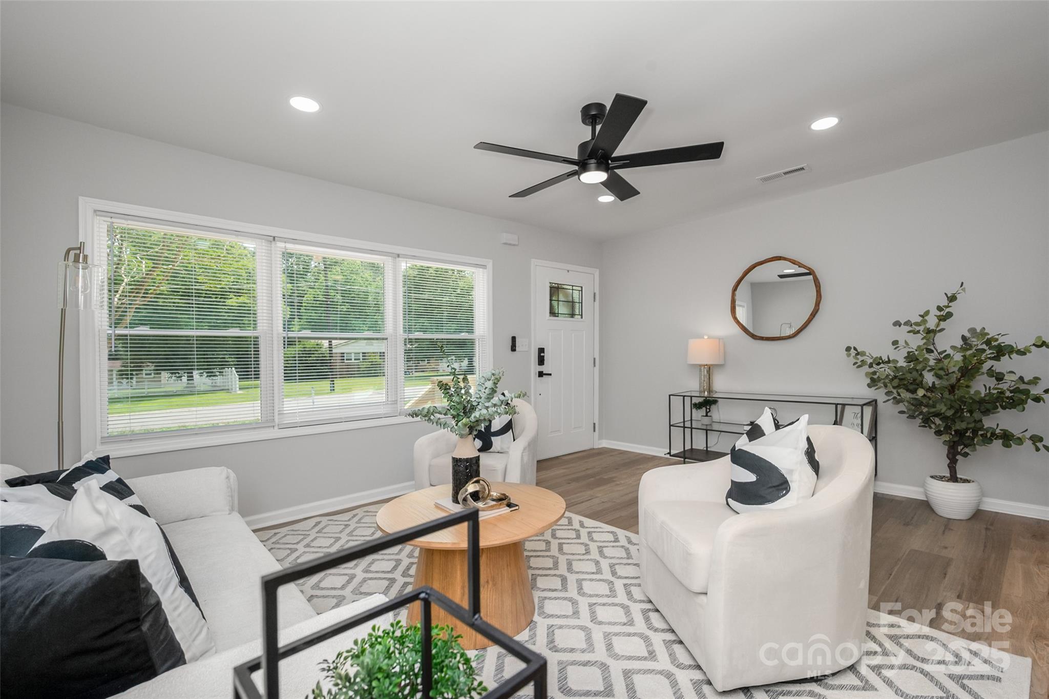 756 Logan Street Mooresville, NC 28115 - Photo 4 of 30 a living room with furniture and a large window