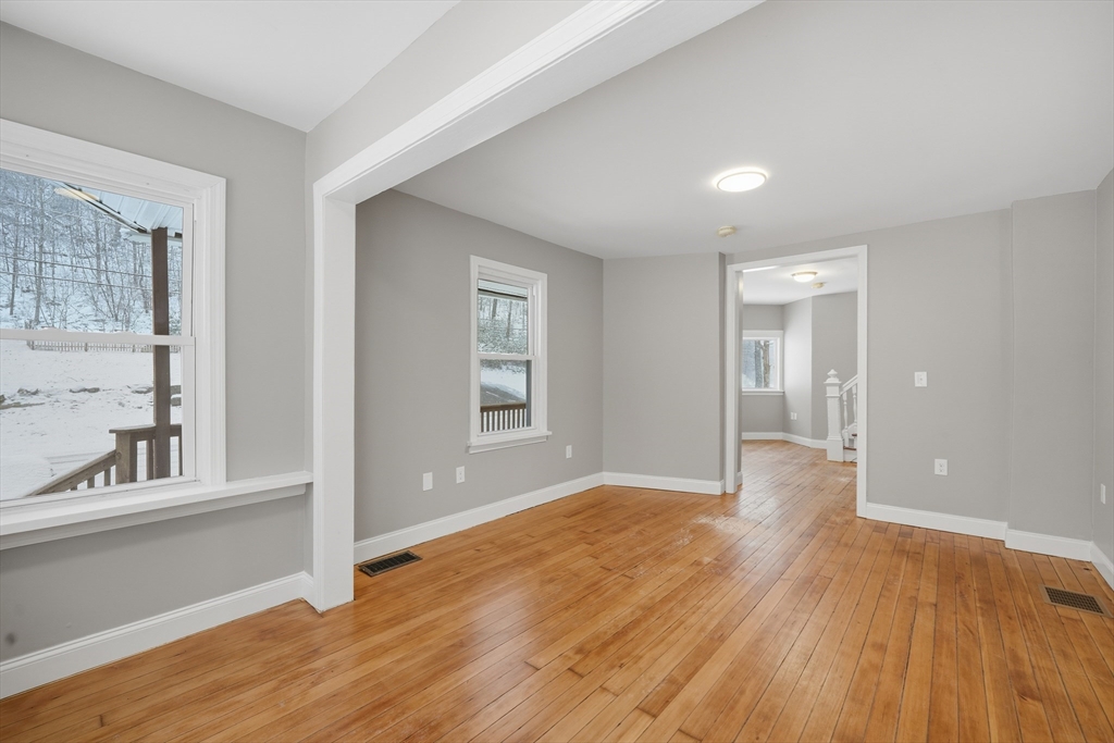 1209 Brimfield Road Warren, MA 01083 - Photo 11 of 41 wooden floor in an empty room with a window