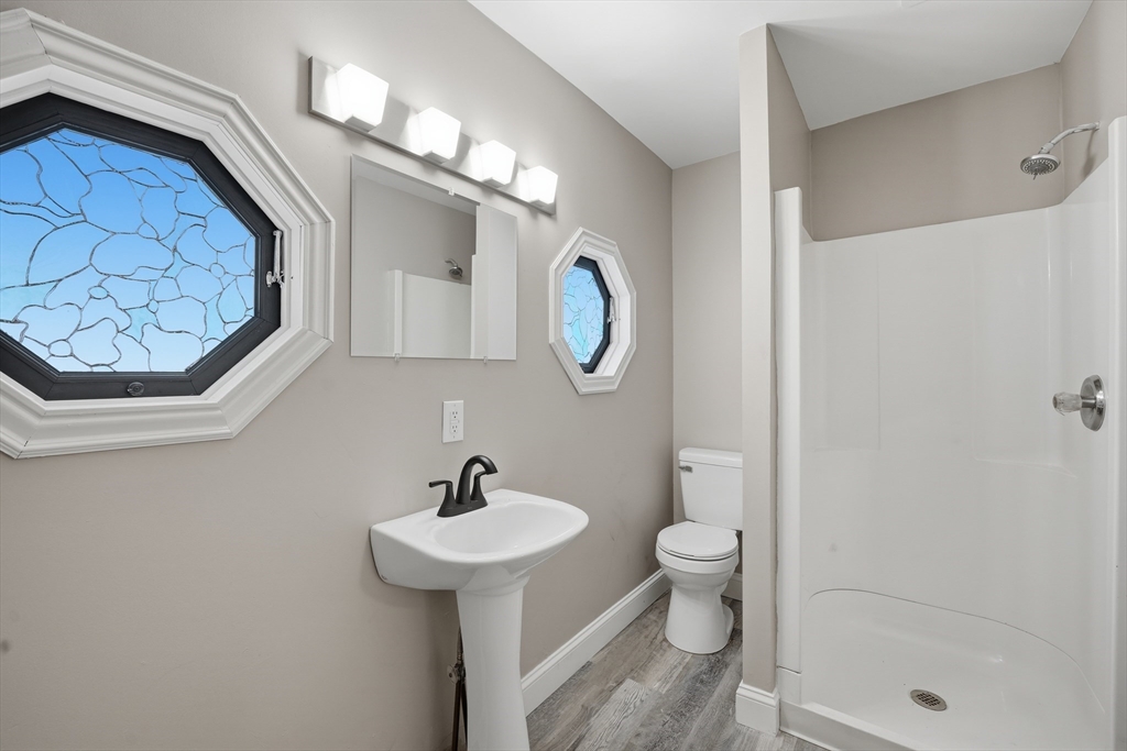 1209 Brimfield Road Warren, MA 01083 - Photo 15 of 41 a bathroom with a sink a toilet and a mirror