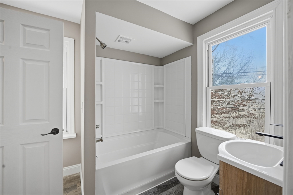1209 Brimfield Road Warren, MA 01083 - Photo 27 of 41 a bathroom with a toilet a sink and a bathtub