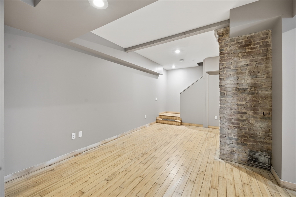 1209 Brimfield Road Warren, MA 01083 - Photo 31 of 41 a view of empty room with wooden floor and fan