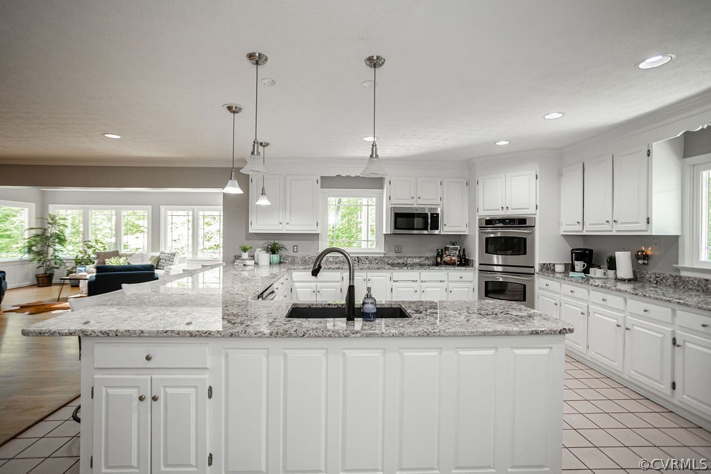 Pendant light fixtures above the Lovely Granite co