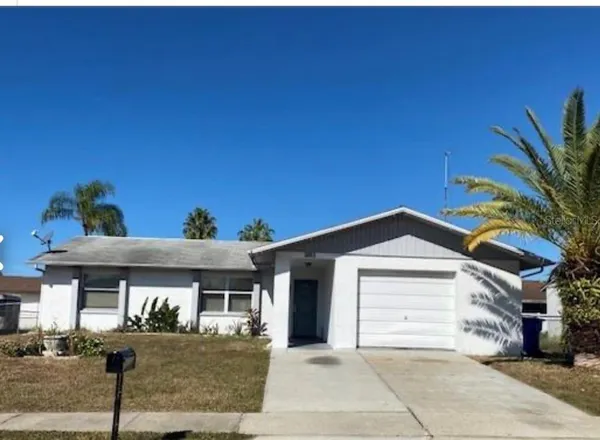 a front view of a house with garage