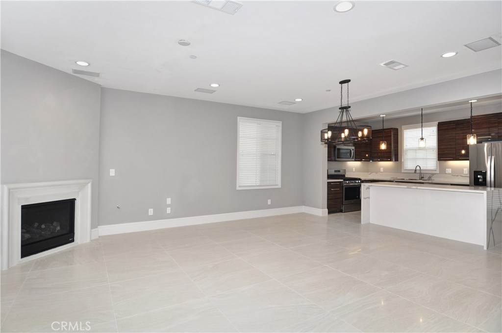 a view of a kitchen with a sink and a stove top oven