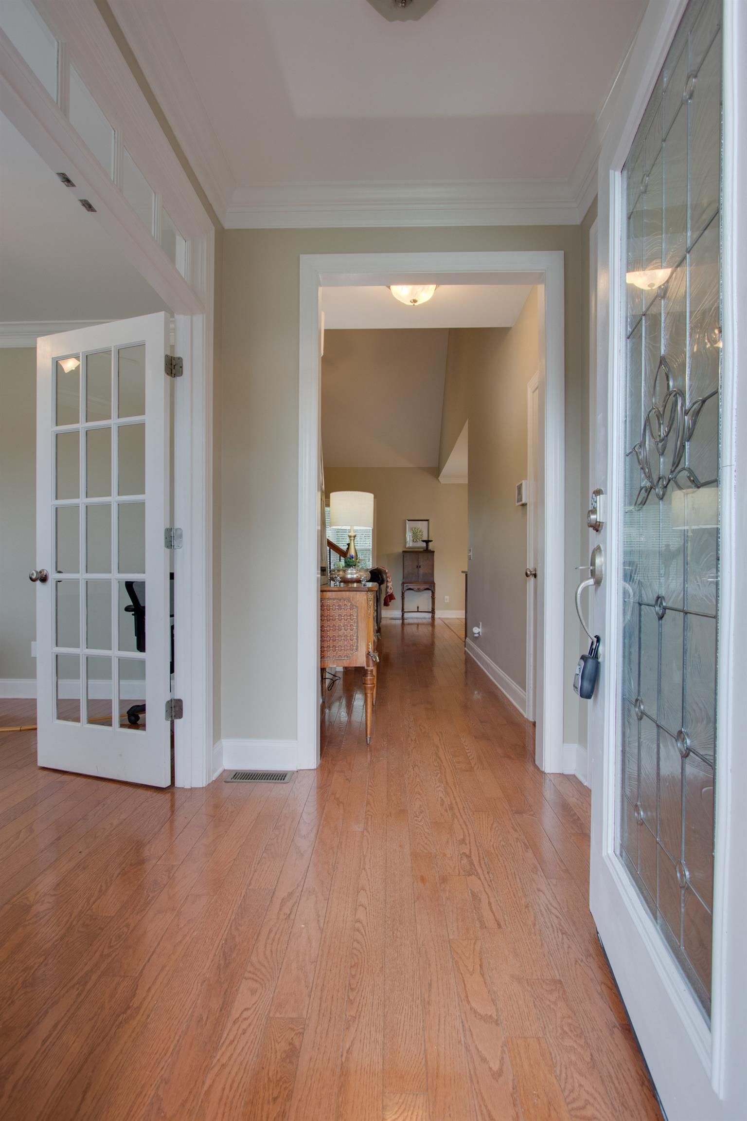 75 Abbey Road Lebanon, TN 37090 - Photo 3 of 30 a view of a hallway with wooden floor and a living room