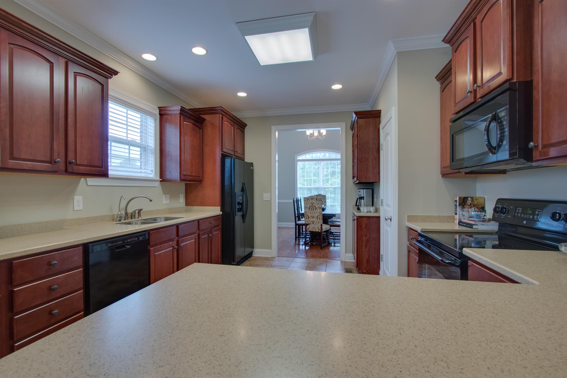 75 Abbey Road Lebanon, TN 37090 - Photo 8 of 30 a kitchen with stainless steel appliances granite countertop a refrigerator stove top oven a sink and dishwasher
