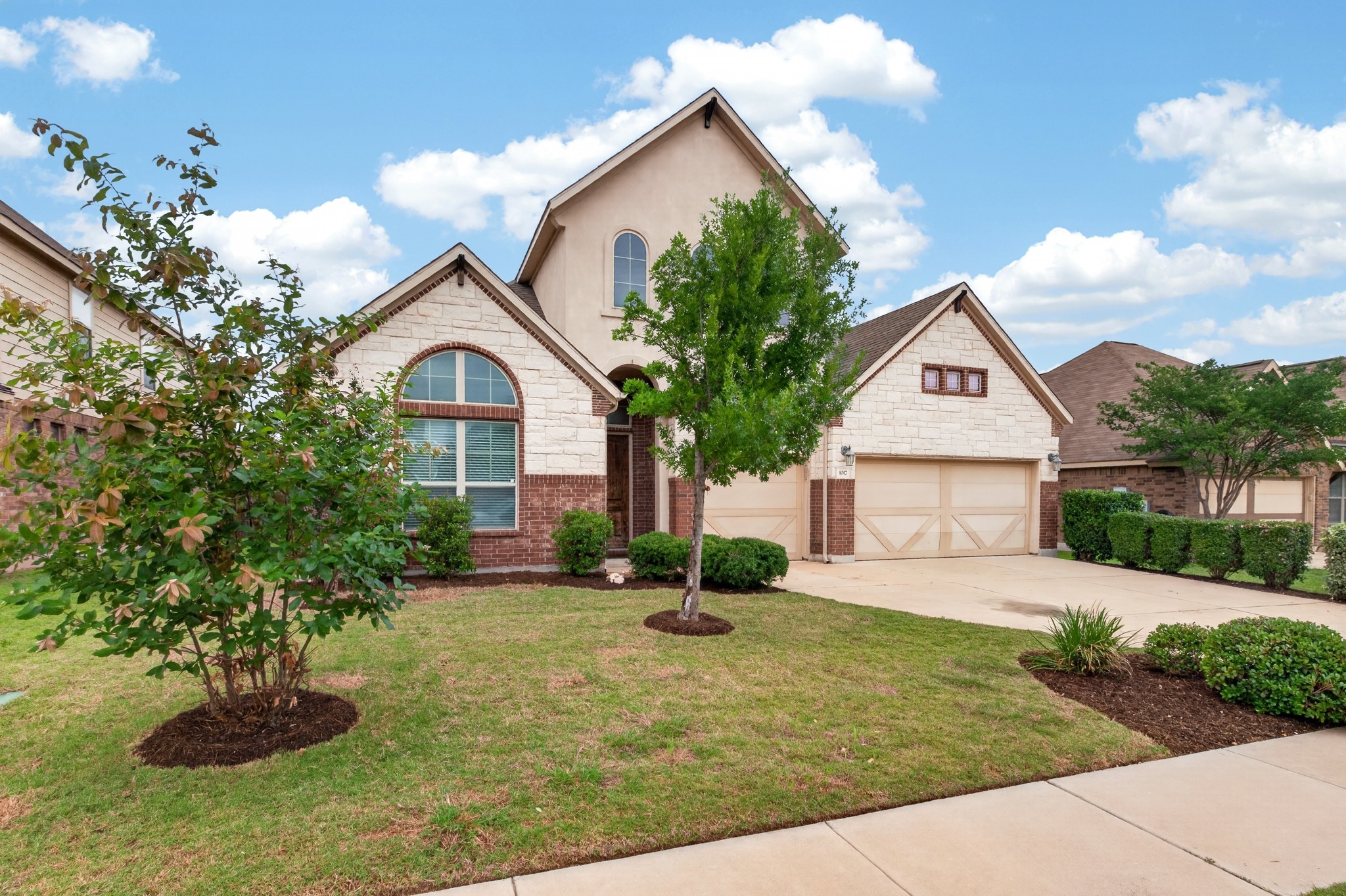 1017 Tabernash Leander, TX 78641 - Photo 3 of 38 Distinguished stucco and stone facade with brick accents