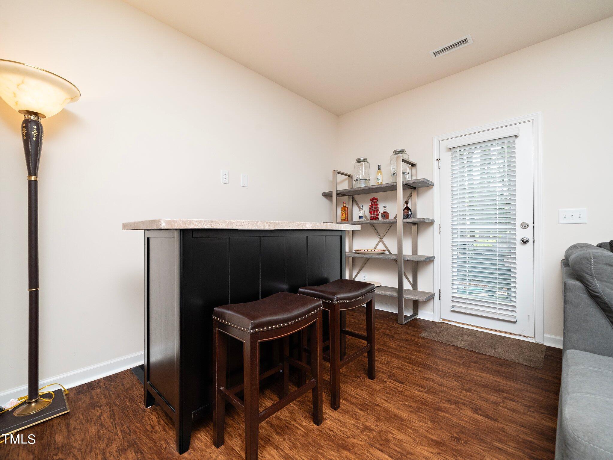 8804 Commons Townes Drive Raleigh, NC 27616 - Photo 12 of 21 a workspace with furniture and wooden floor