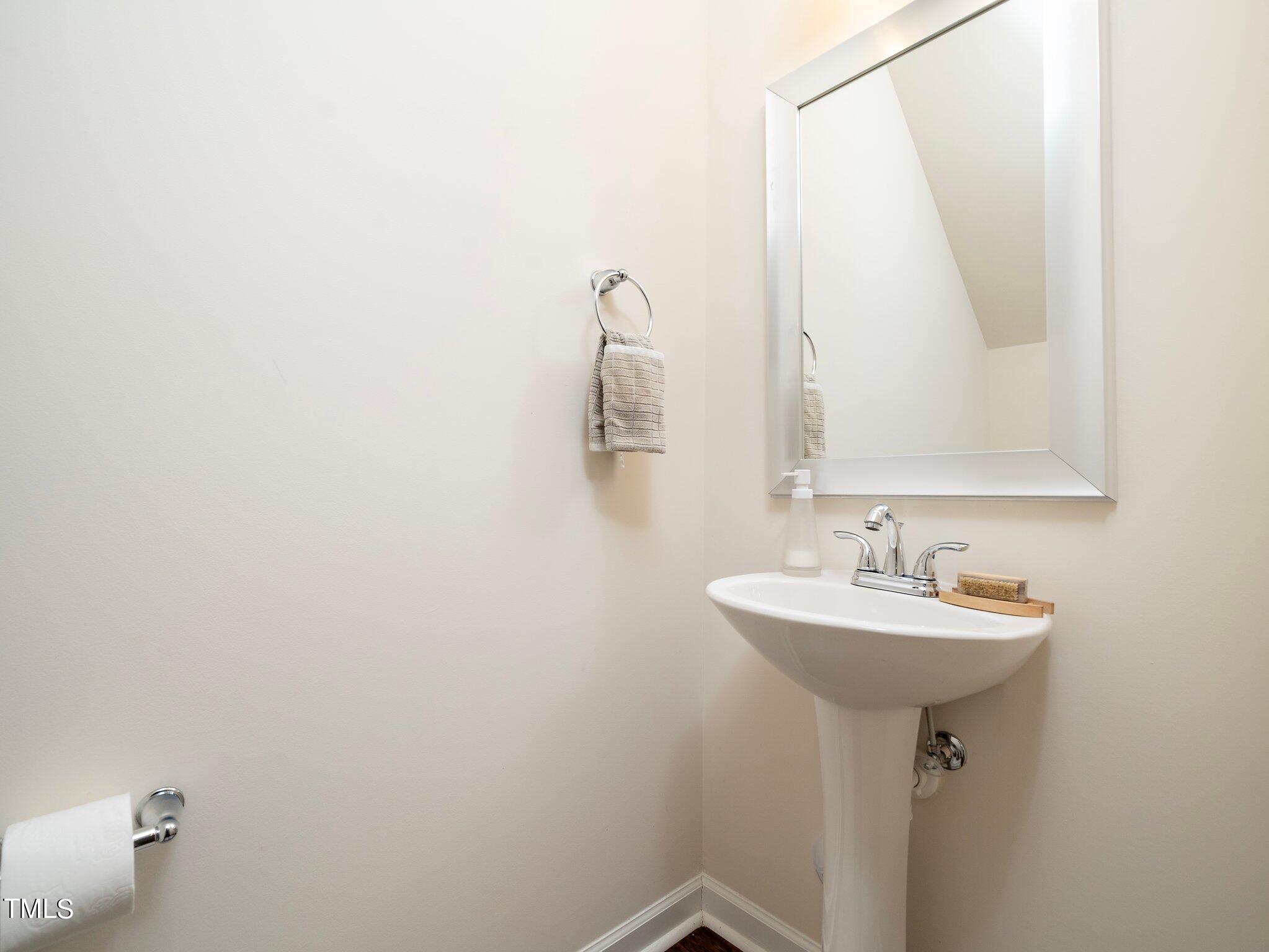 8804 Commons Townes Drive Raleigh, NC 27616 - Photo 13 of 21 a bathroom with a sink and mirror