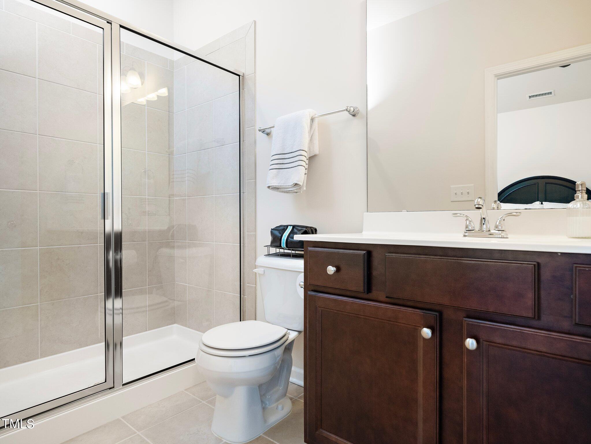 8804 Commons Townes Drive Raleigh, NC 27616 - Photo 15 of 21 a bathroom with a sink a toilet and shower