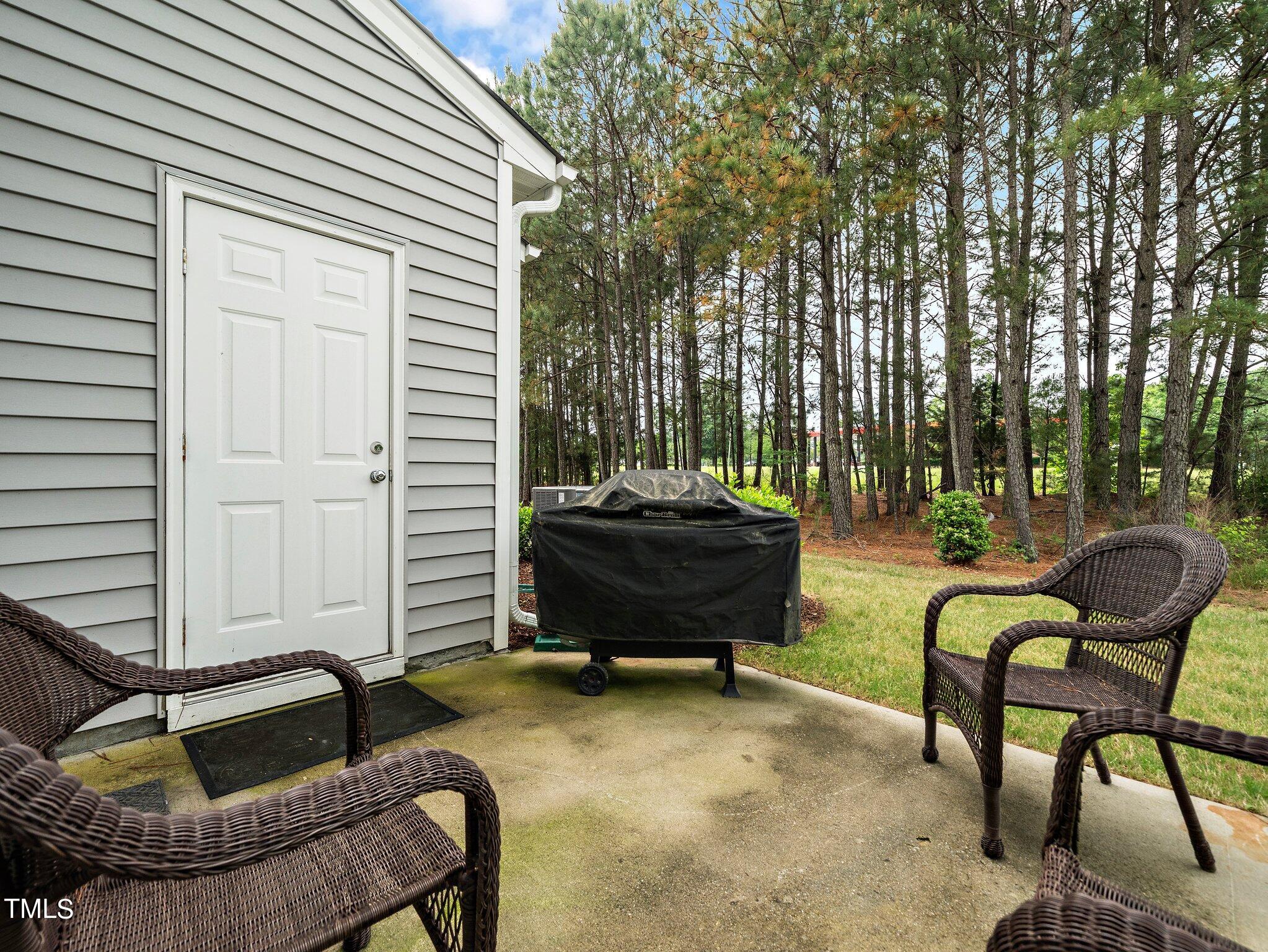 8804 Commons Townes Drive Raleigh, NC 27616 - Photo 19 of 21 a backyard of a house with seating space
