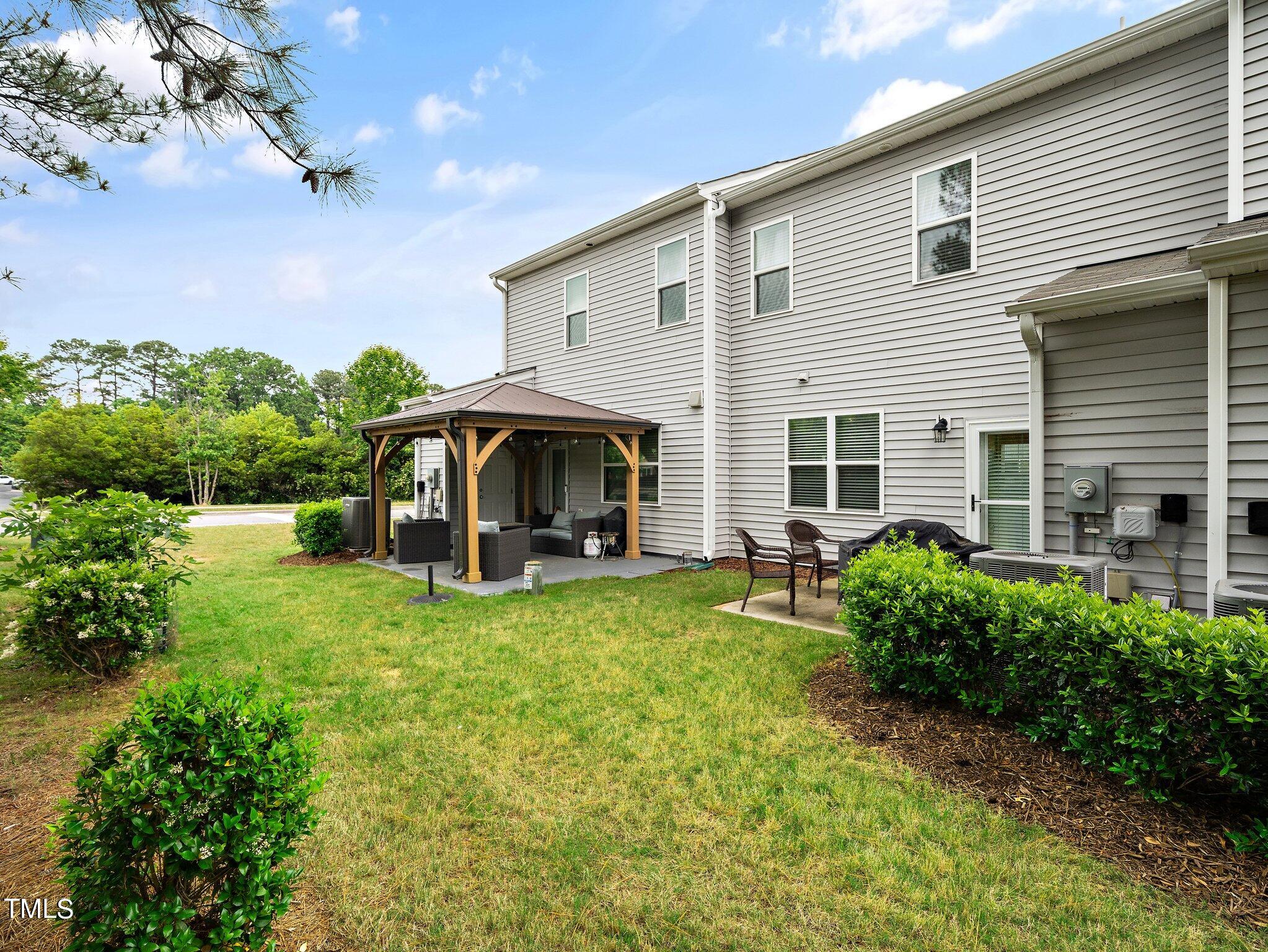 8804 Commons Townes Drive Raleigh, NC 27616 - Photo 21 of 21 a view of house with backyard space and garden