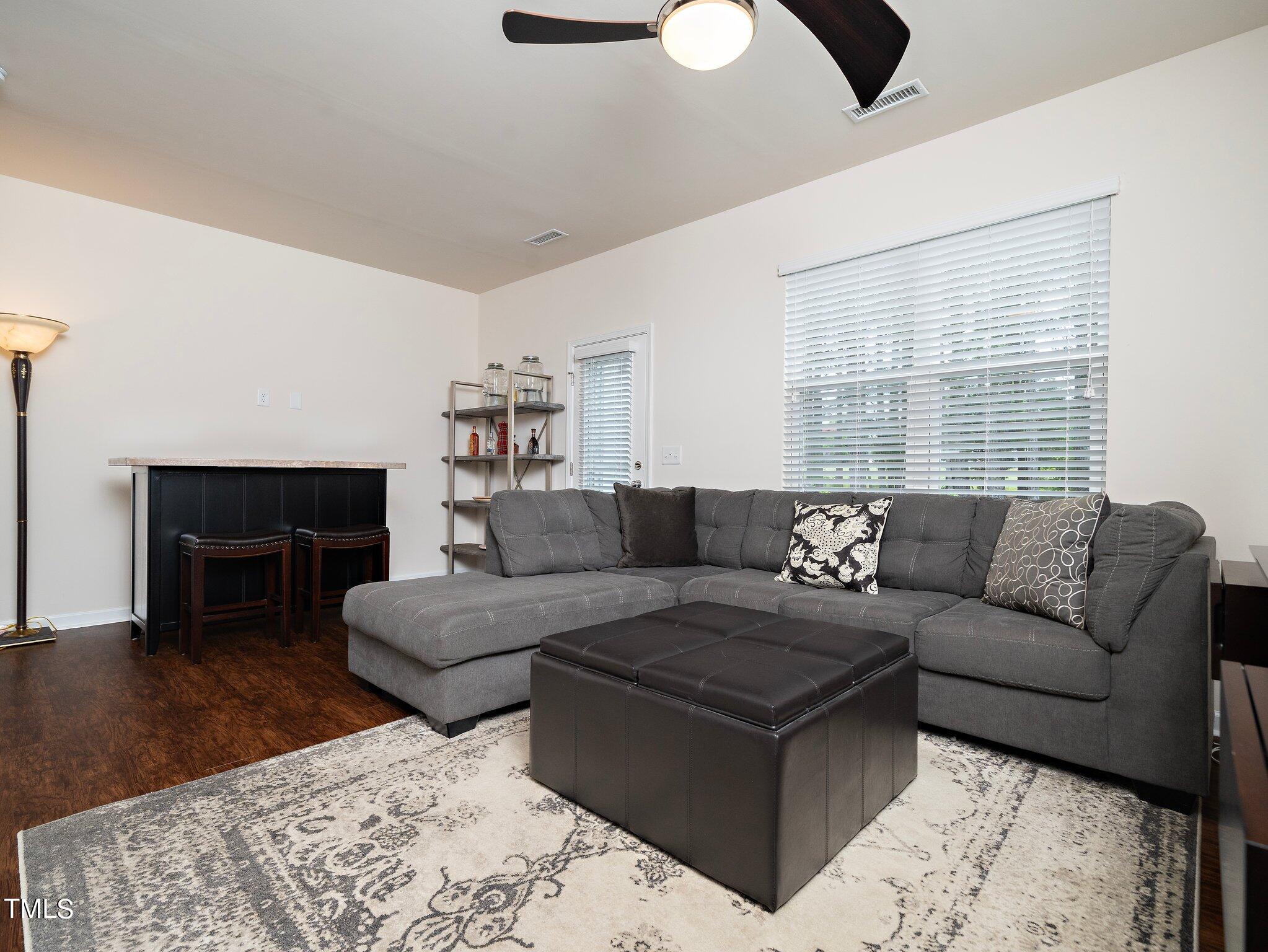 8804 Commons Townes Drive Raleigh, NC 27616 - Photo 10 of 21 a living room with furniture and a fireplace