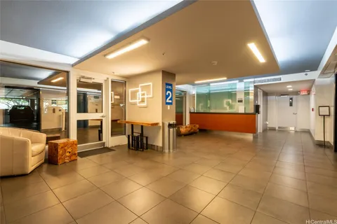 a lobby with furniture and window