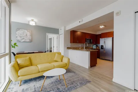 a living room with furniture kitchen and kitchen view