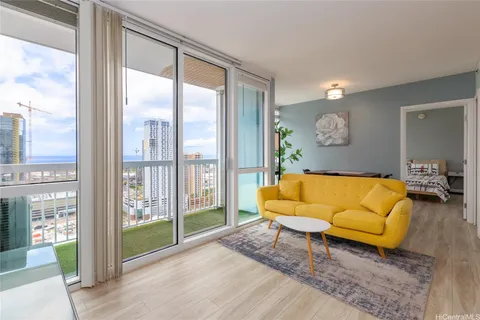 a living room with furniture and a large window