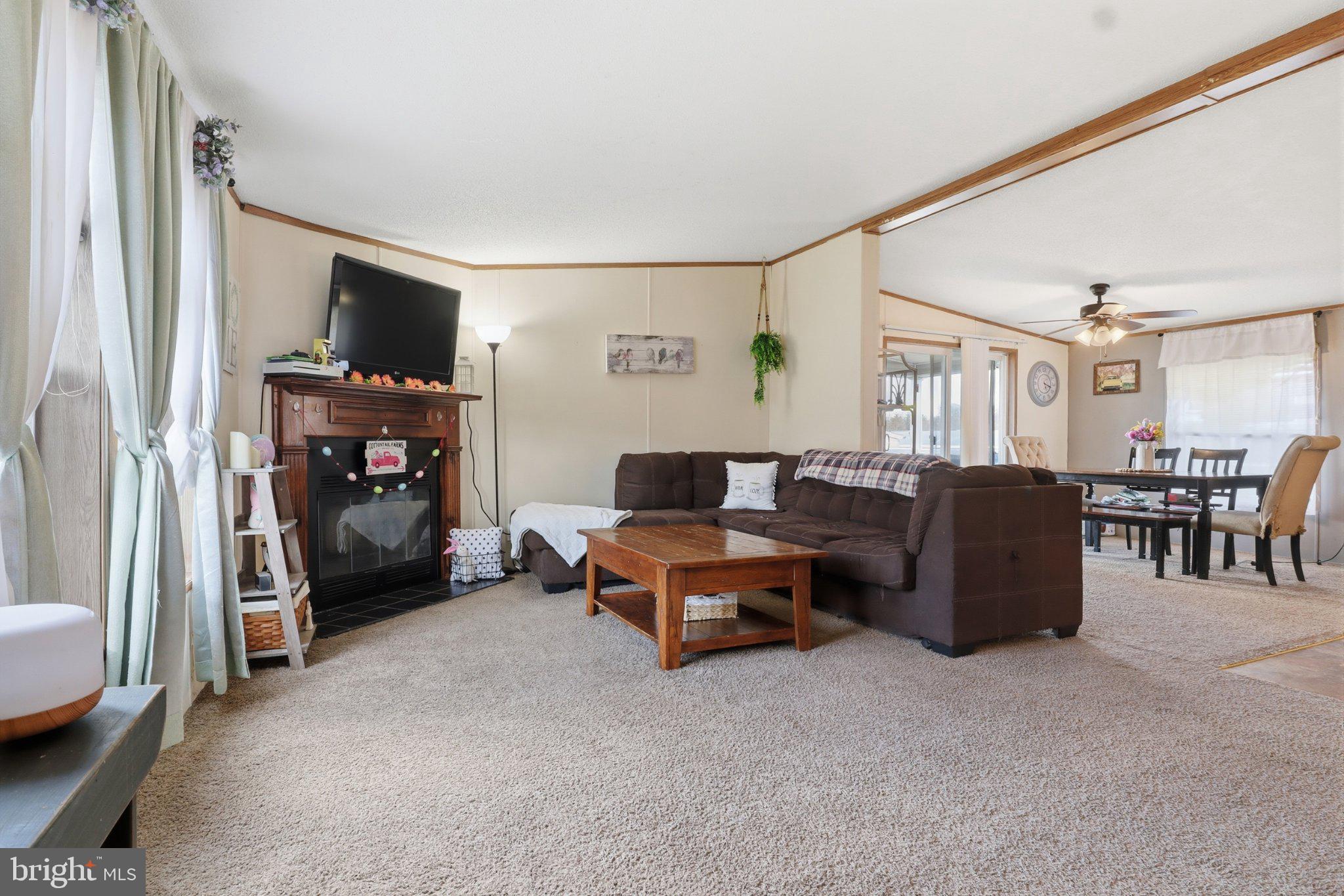 4820 Old Harrisburg Road, Unit 11 Gettysburg, PA 17325 - Photo 11 of 29 a living room with furniture and a flat screen tv