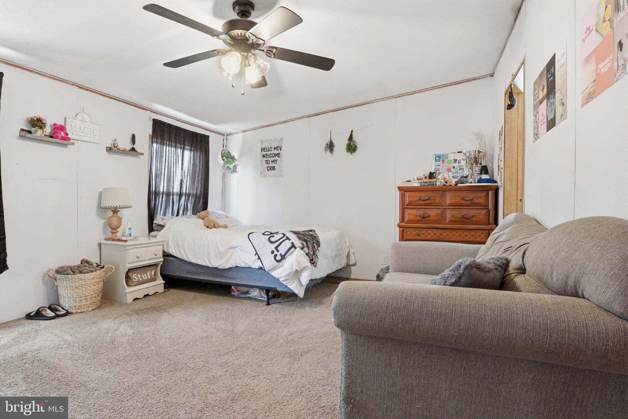4820 Old Harrisburg Road, Unit 11 Gettysburg, PA 17325 - Photo 18 of 29 a living room with furniture and a chandelier