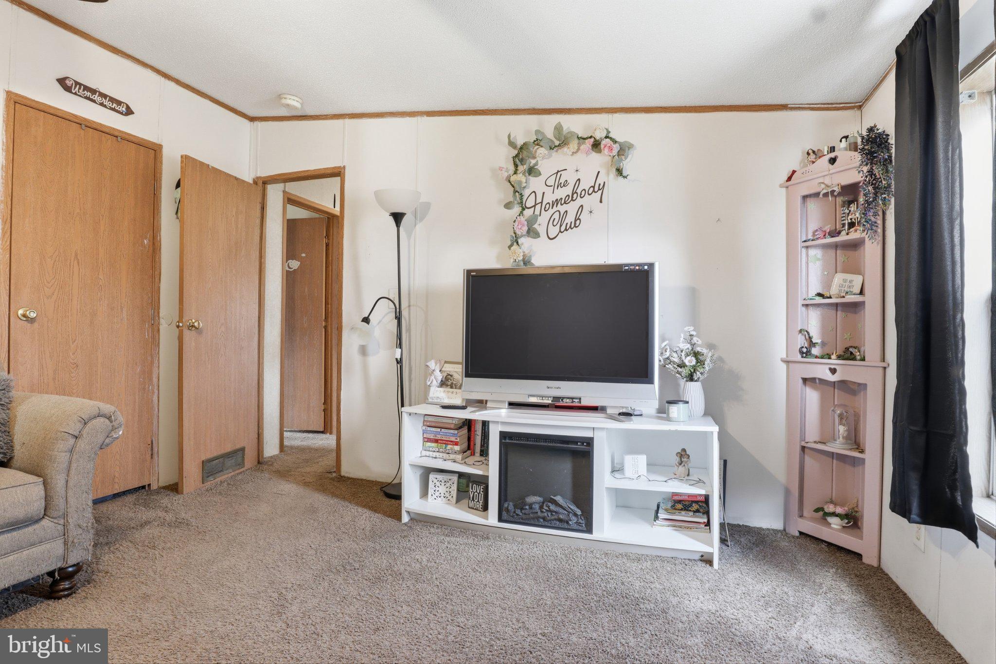 4820 Old Harrisburg Road, Unit 11 Gettysburg, PA 17325 - Photo 19 of 29 a view of a livingroom with furniture and a flat screen tv