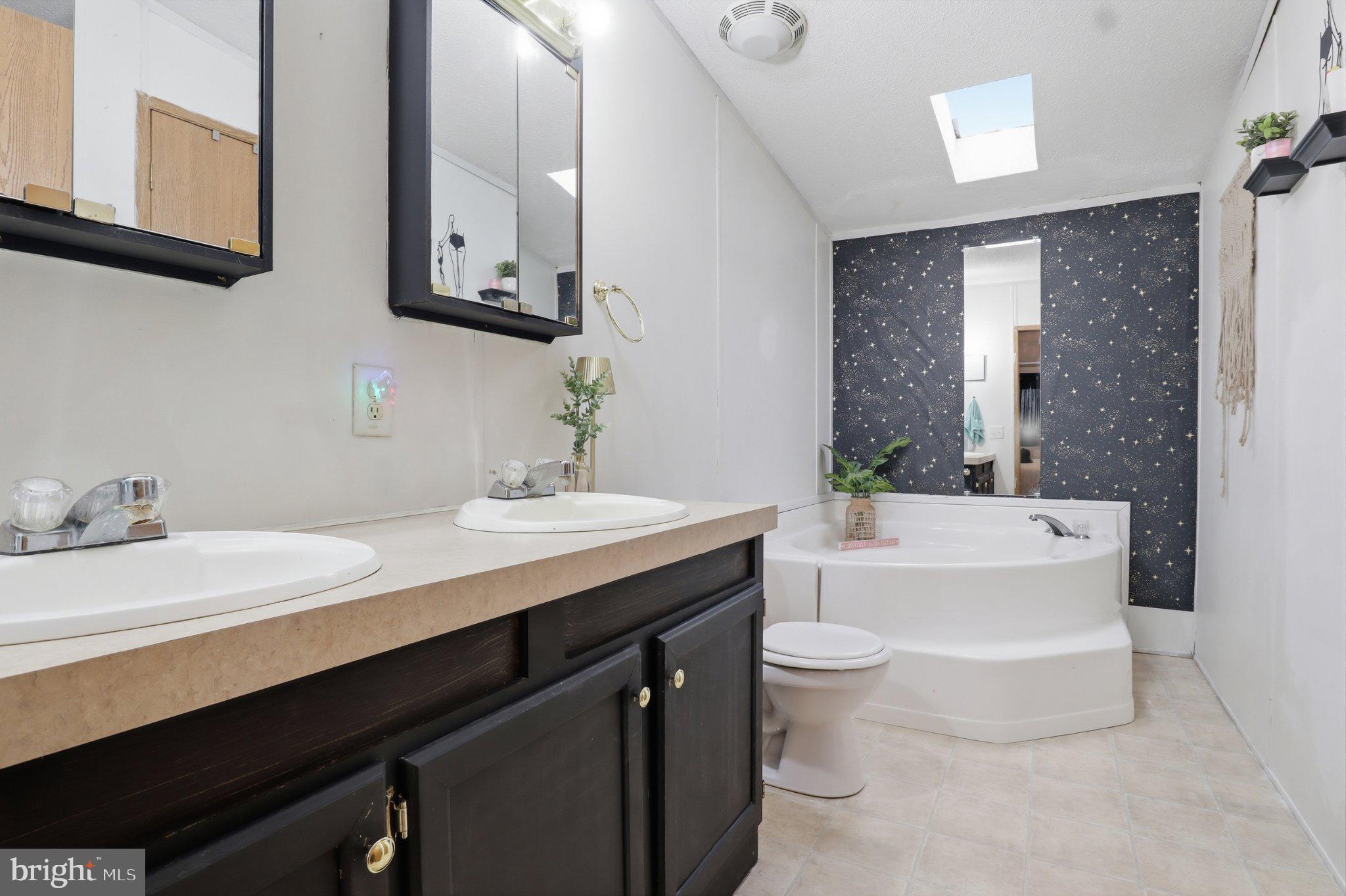 4820 Old Harrisburg Road, Unit 11 Gettysburg, PA 17325 - Photo 20 of 29 a bathroom with a double vanity sink and a mirror