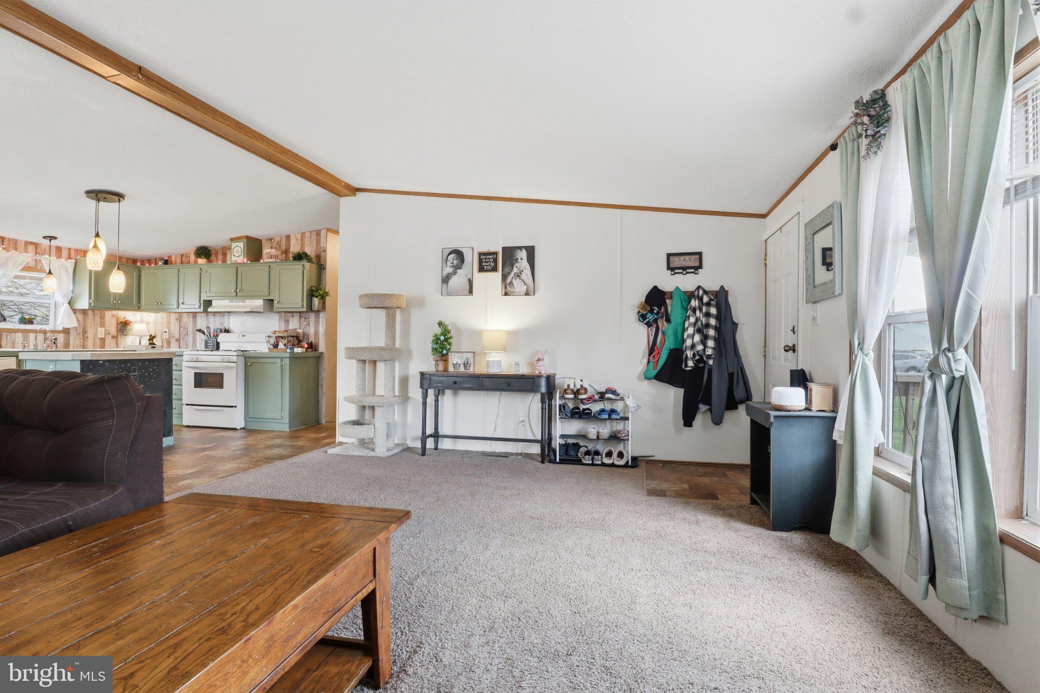 4820 Old Harrisburg Road, Unit 11 Gettysburg, PA 17325 - Photo 4 of 29 a living room with furniture and a flat screen tv