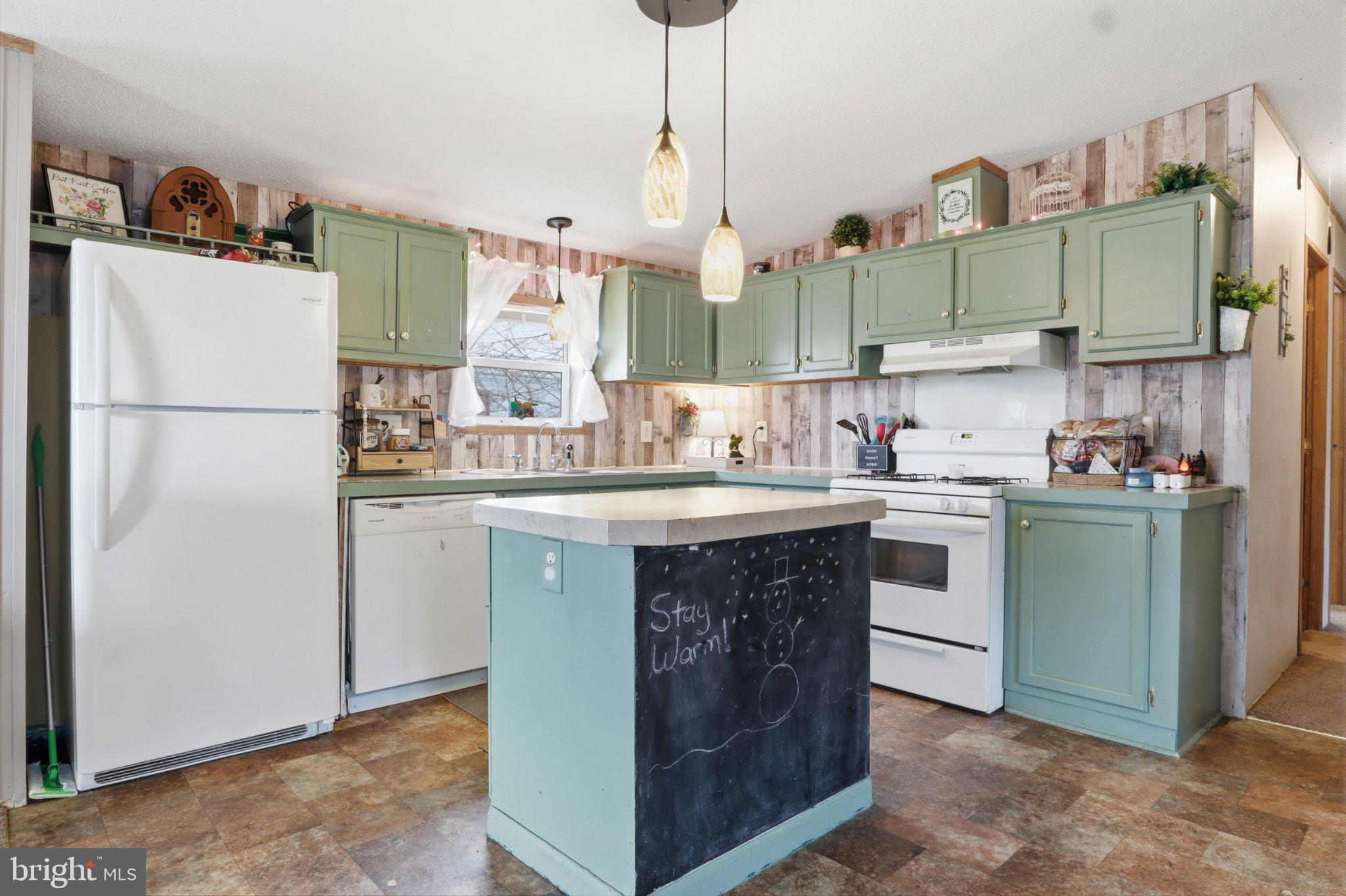 4820 Old Harrisburg Road, Unit 11 Gettysburg, PA 17325 - Photo 5 of 29 a kitchen with cabinets and white appliances