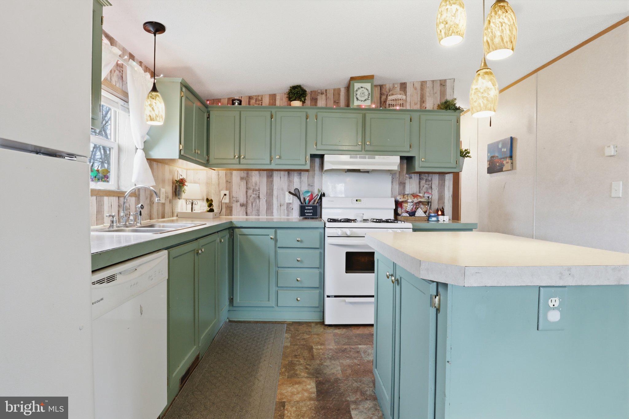 4820 Old Harrisburg Road, Unit 11 Gettysburg, PA 17325 - Photo 6 of 29 a kitchen with cabinets and white appliances