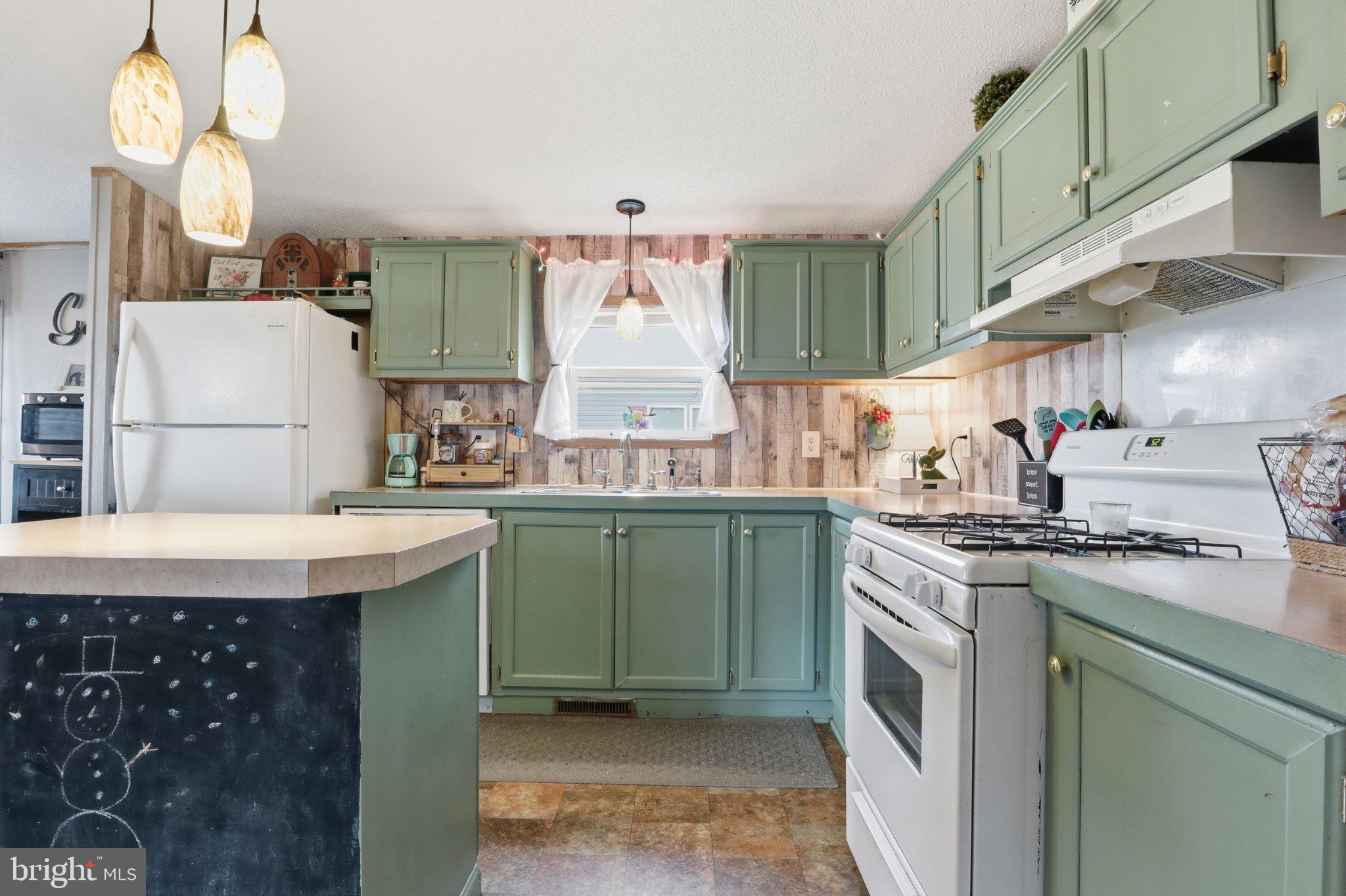 4820 Old Harrisburg Road, Unit 11 Gettysburg, PA 17325 - Photo 7 of 29 a kitchen with a sink a stove and cabinets