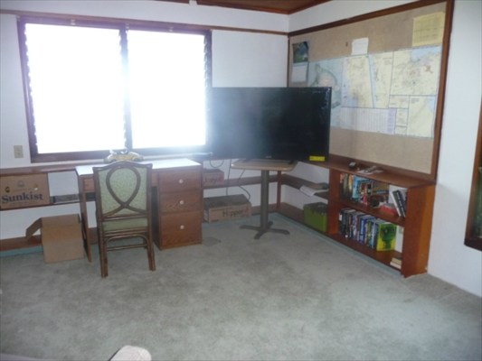 82-6061 Captain Cook Village Road Captain Cook, HI 96704 - Photo 13 of 16 a living room with furniture and a flat screen tv