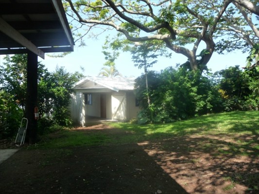 82-6061 Captain Cook Village Road Captain Cook, HI 96704 - Photo 16 of 16 a front view of a house with a yard and trees