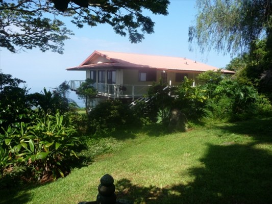 82-6061 Captain Cook Village Road Captain Cook, HI 96704 - Photo 2 of 16 a front view of house with yard and green space