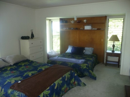 82-6061 Captain Cook Village Road Captain Cook, HI 96704 - Photo 10 of 16 a bedroom with a bed and a window