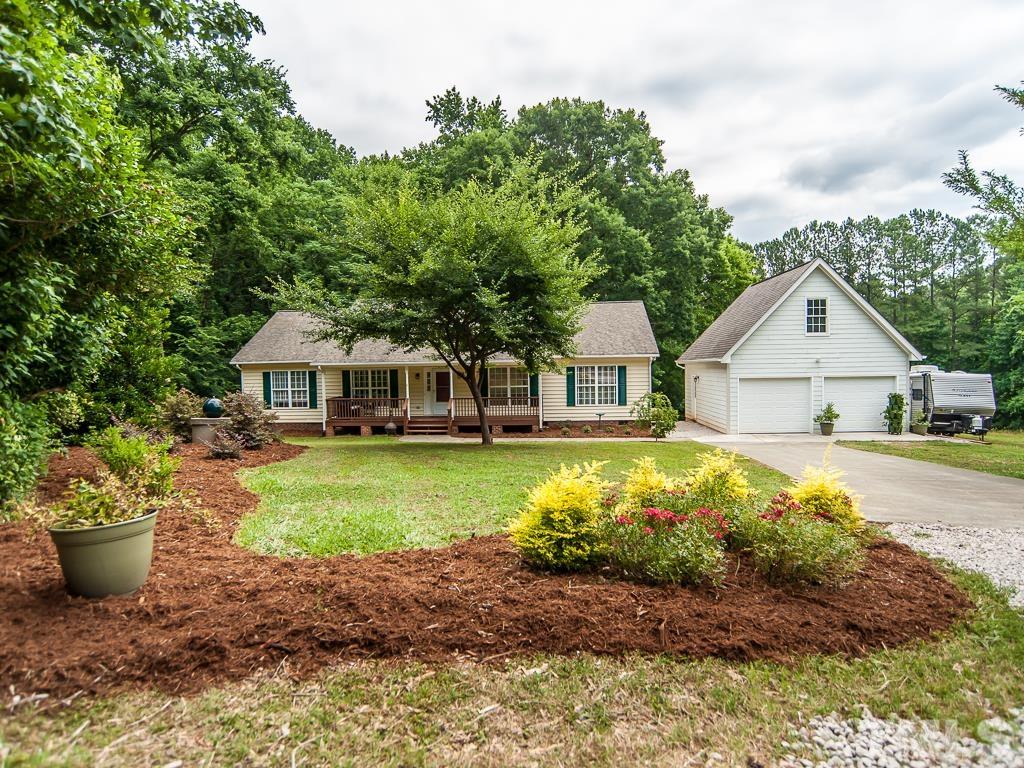4900 Raytown Road Raleigh, NC 27613 - Photo 1 of 34 a front view of a house with a yard having outdoor seating