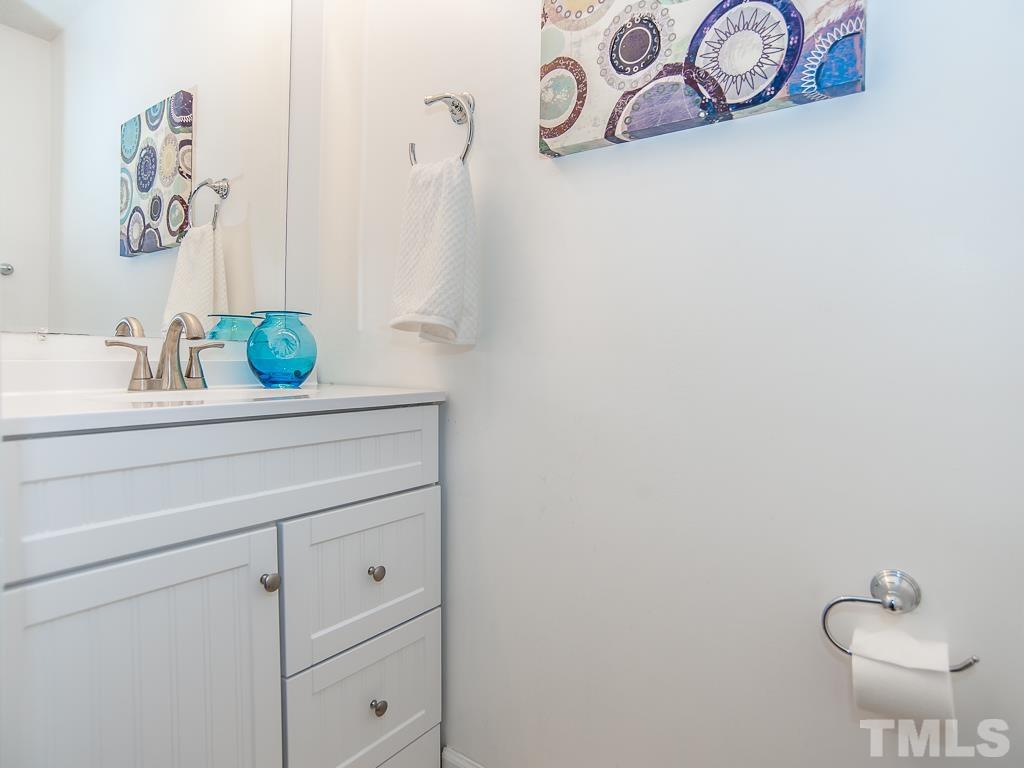 4900 Raytown Road Raleigh, NC 27613 - Photo 20 of 34 a bathroom with a sink and a mirror