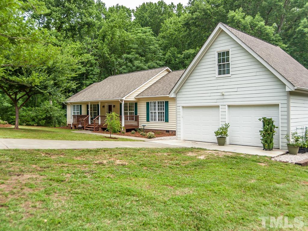 4900 Raytown Road Raleigh, NC 27613 - Photo 28 of 34 a view of a house with a yard and sitting area