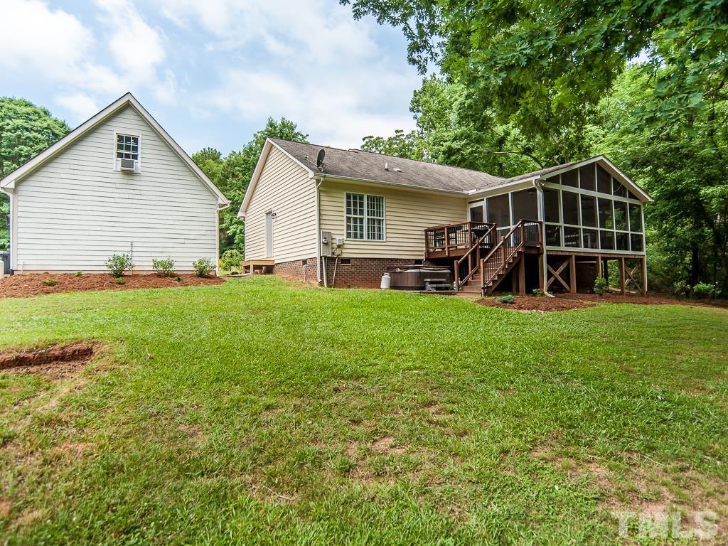 4900 Raytown Road Raleigh, NC 27613 - Photo 29 of 34 a view of a house with a yard and sitting area