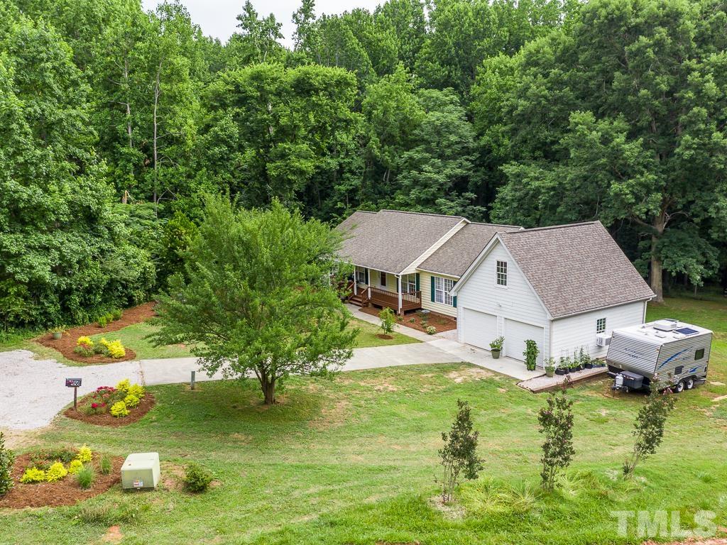4900 Raytown Road Raleigh, NC 27613 - Photo 31 of 34 an aerial view of a house with swimming pool a yard and lake view