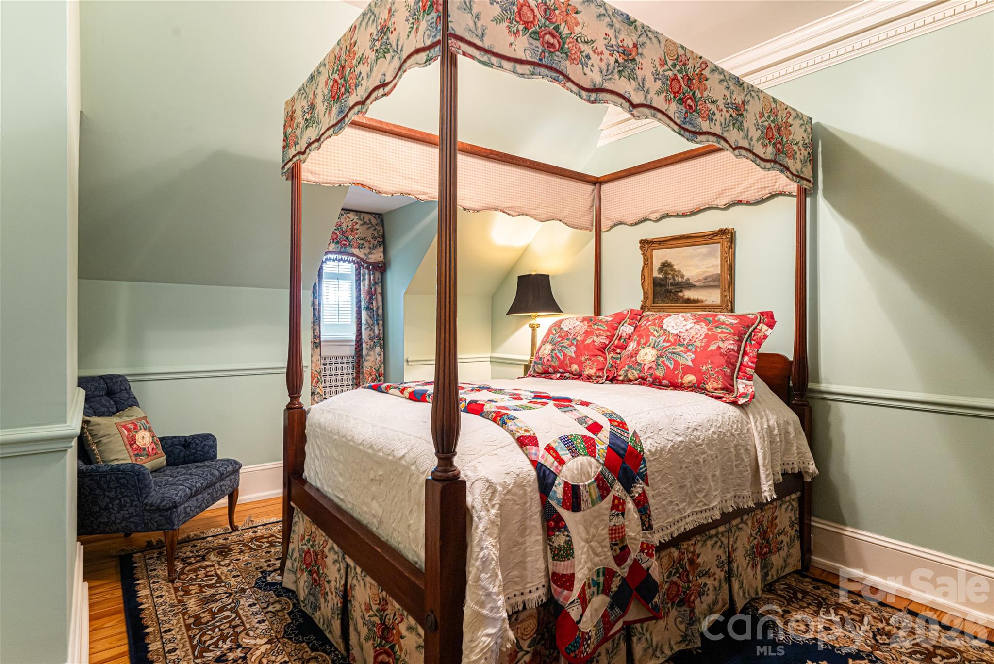324 Vanderbilt Road Asheville, NC 28803 - Photo 37 of 48 a bedroom with a bed a table and chair