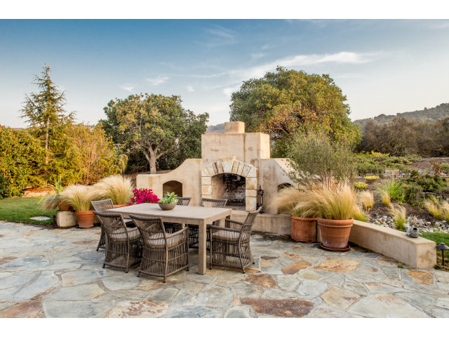 401 Estrella Doro Monterey, CA 93940 - Photo 11 of 25 a view of a patio with table and chairs and potted plants