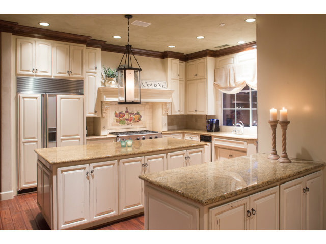401 Estrella Doro Monterey, CA 93940 - Photo 7 of 25 a kitchen with stainless steel appliances granite countertop a sink window and cabinets