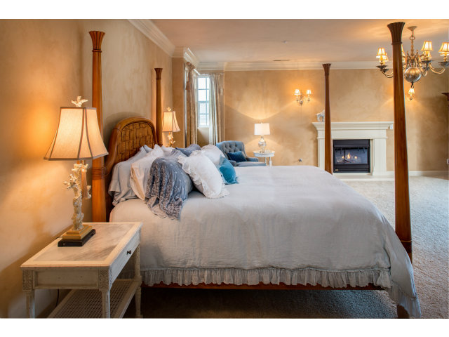 401 Estrella Doro Monterey, CA 93940 - Photo 9 of 25 a bedroom with a bed and a fireplace