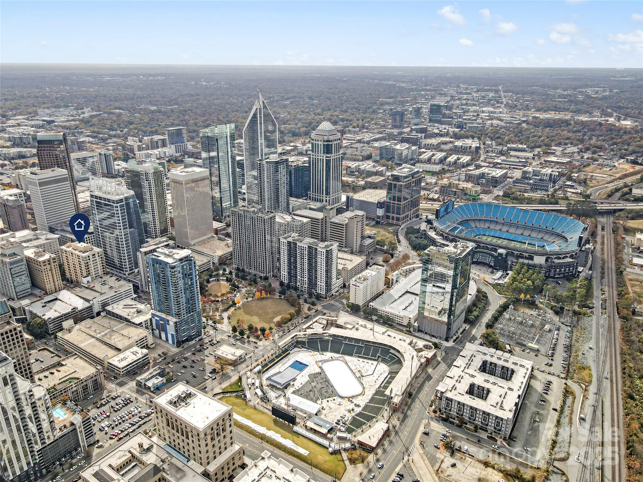 230 South Tryon Street, Unit 603 Charlotte, NC 28281 - Photo 2 of 32 an aerial view of a city with lots of residential buildings